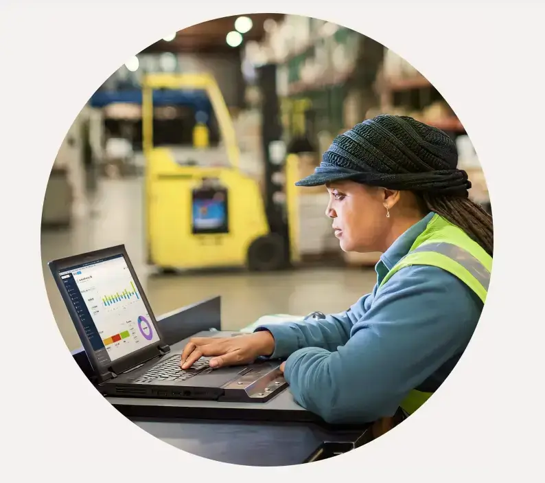 Employee using QuickBooks Enterprise in warehouse